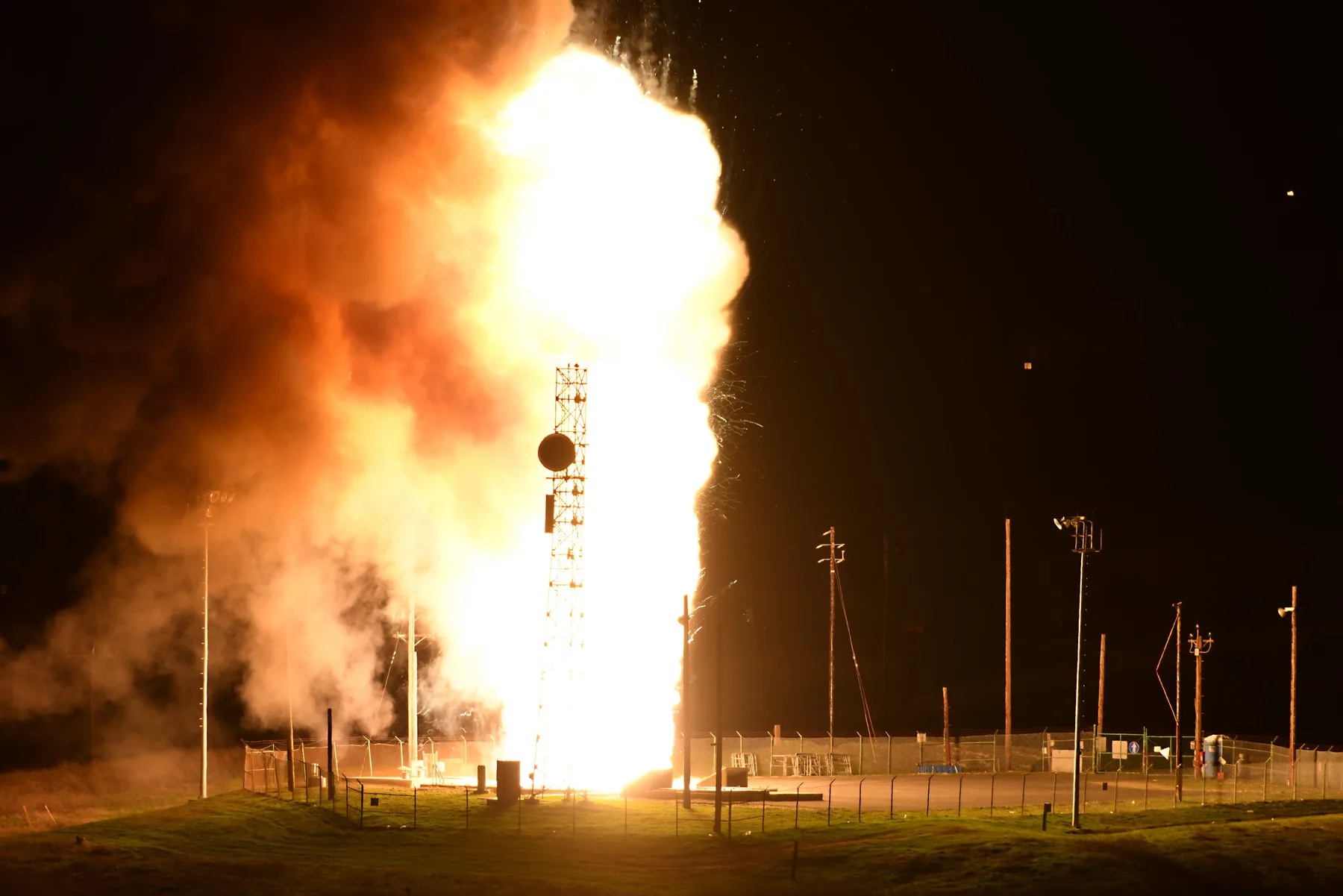An unarmed Minuteman III intercontinental ballistic missile lifting off during an operational test launch